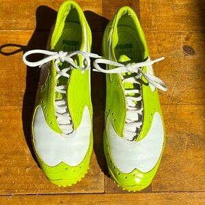 PUMA asymmetrical gold shoes. Sz7 lime green and white.